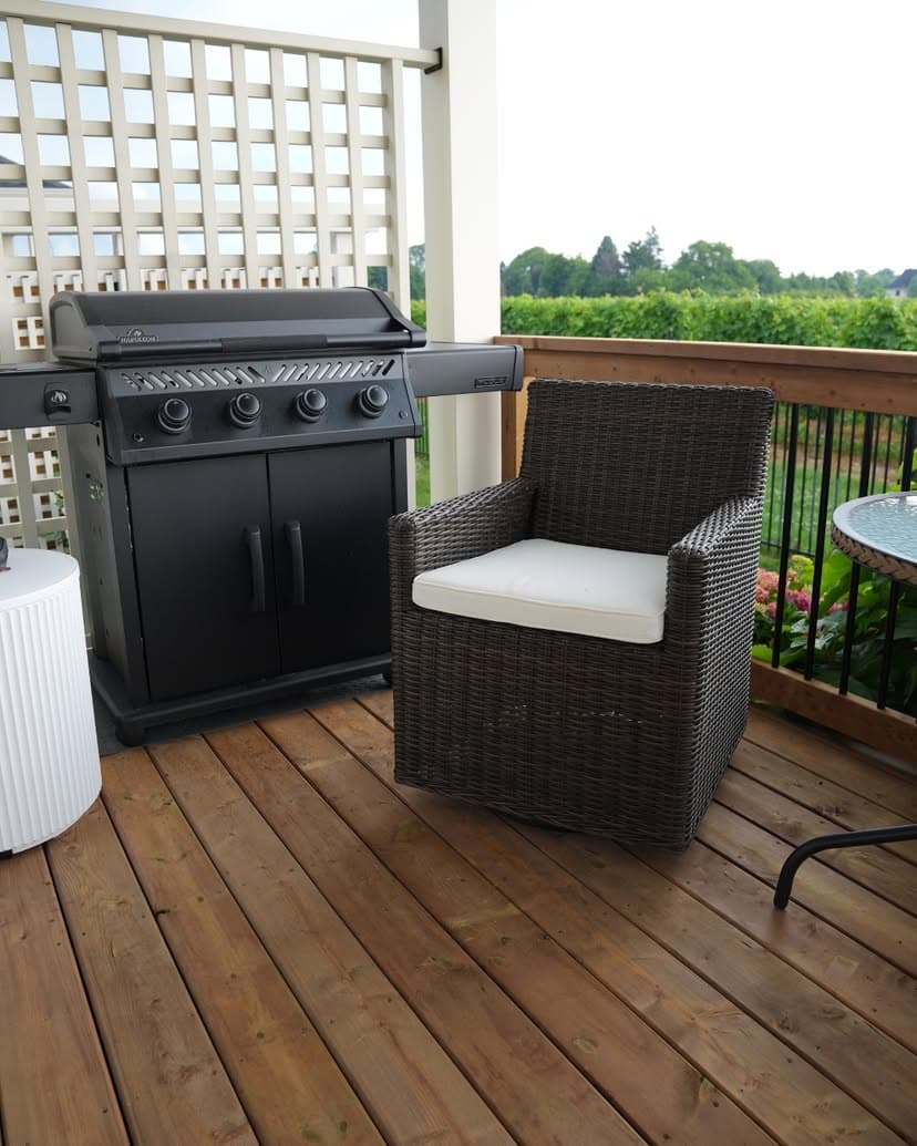New cedar deck with outdoor seating overlooking a Niagara vineyard